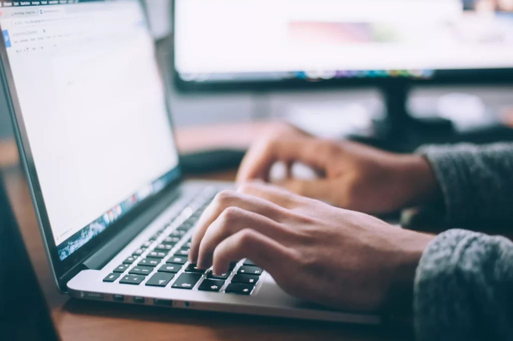 Start Your Online Typing Job Today 1 xperson using MacBook Pro scaled.jpg.pagespeed.ic .meuEyycM6y
